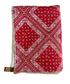 Red bandana with white patterns on a light beige background