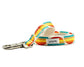 Colorful striped dog leash with a metal clip on a white background
